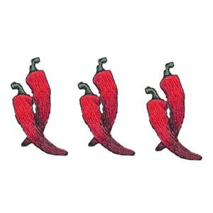 May include: Three red chili peppers with green stems, embroidered in a cluster of two peppers each.