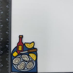 Strykmärke med ostronfat – Applikation med musslor och skaldjursfat, citron och stark sås bild 2