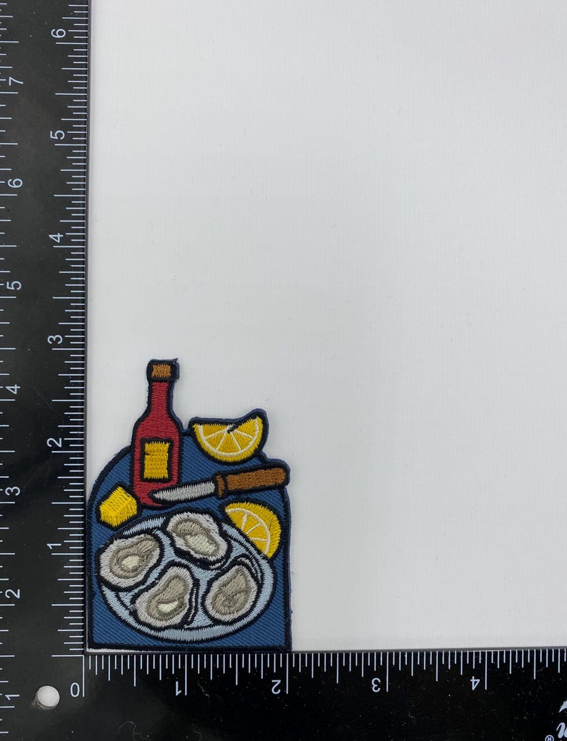 Strykmärke med ostronfat – Applikation med musslor och skaldjursfat, citron och stark sås bild 2