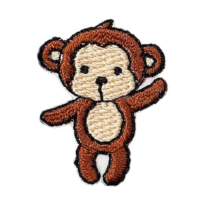 Peut inclure: Applique brodée de singe marron avec un ventre blanc et un bras levé.