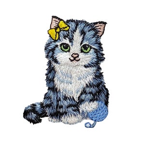 May include: A blue and white kitten with a yellow bow sits with a blue ball of yarn. The kitten has green eyes and a pink nose.