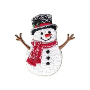 May include: An embroidered iron-on patch featuring a white snowman with a black top hat, a red scarf with white detailing, a small orange carrot nose, and three black circular buttons on its torso, with brown stick-like arms extended outward.