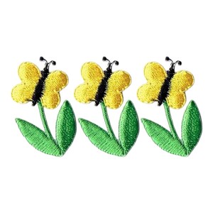 May include: Three embroidered patches featuring yellow butterflies with black details atop green stems and leaves. The patches are designed with a stitched texture, perfect for adding to clothing or accessories.