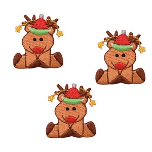 May include: Three embroidered iron-on patches of a reindeer wearing a red and green Santa hat with a gold star on top. The reindeer is sitting down with its legs crossed.