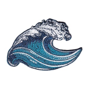 May include: Embroidered patch featuring a stylized ocean wave. The wave is depicted in shades of blue and white, with intricate stitching details. The patch is designed to be ironed on or sewn onto fabric, suitable for adding a decorative element to clothing or accessories.