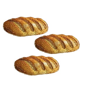 May include: Three embroidered patches of golden brown bread loaves. Each loaf has a slightly different shape and texture.