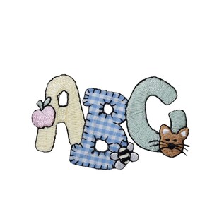 May include: A colorful embroidered patch with the letters ABC. The letter A has a pink apple, the letter B has a blue and white checkered pattern and a bee, and the letter C has a brown cat.