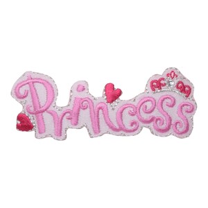 May include: Pink embroidered iron-on patch with the word "Princess" and a crown with a rhinestone.
