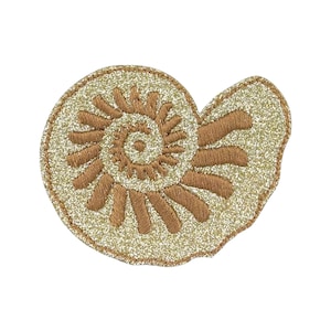 May include: Embroidered patch in the shape of a fossilized ammonite. The patch features a spiral design in shades of brown and gold, with a glittery, textured background. The patch is likely for decorative purposes.