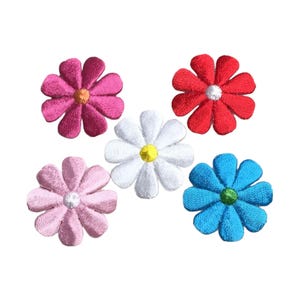 May include: Five embroidered flower patches in various colors, including pink, red, white, and blue. Each flower has a yellow center.