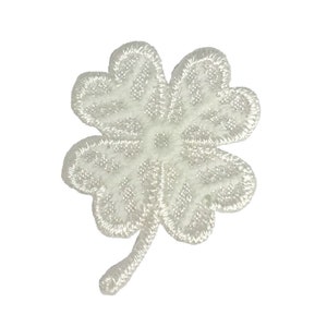 May include: White embroidered four-leaf clover patch with a stem.