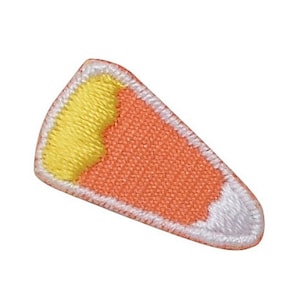 May include: A felt patch in the shape of a corn cob with a yellow top and orange body. The patch has a white outline.