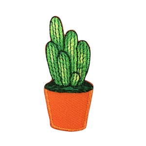 May include: Embroidered patch featuring a green cactus in an orange pot. The cactus has multiple stems with vertical stripes. The pot is a solid orange color with a textured appearance. The patch is designed to be ironed on or sewn onto fabric.