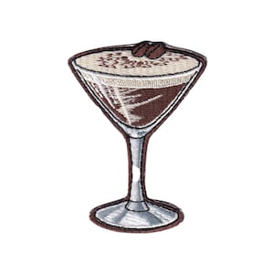 May include: Embroidered patch featuring a coffee martini. The patch has a brown and beige color scheme, with two coffee beans on top. The martini glass is detailed with a silver stem and base, and a brown outline.