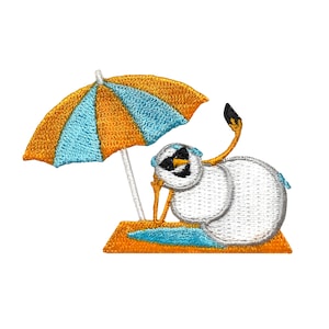 May include: An embroidered patch of a snowman wearing sunglasses and a beach towel, relaxing under a blue and orange striped beach umbrella.