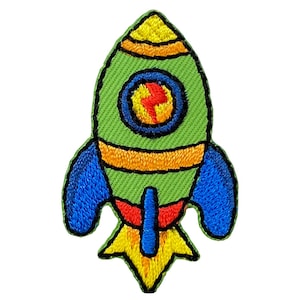 May include: An embroidered rocket ship patch in green, blue, yellow and orange. The rocket has a round window with a red and orange flame inside.