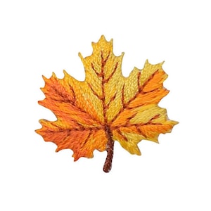 May include: An embroidered maple leaf in shades of yellow and orange with a brown stem.