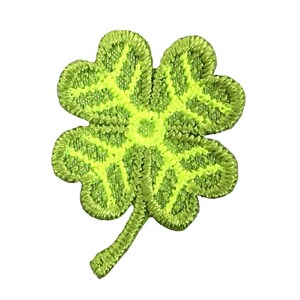 May include: A green four-leaf clover embroidered patch with a yellow center.