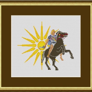 May include: A cross-stitch embroidery of a rider on a rearing horse, with a sunburst behind them. The rider is wearing a blue tunic and a helmet, and the horse is brown. The sunburst is yellow.
