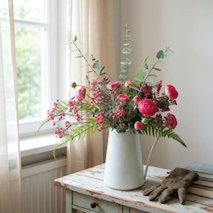 Large red flower display with eucalyptus and ferns