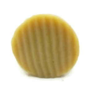 May include: A round, light brown, textured, cookie-like snack.