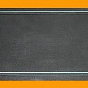 May include: A black rectangular frame with a clear glass insert. The frame is made of a thin, black material and has a simple, modern design.