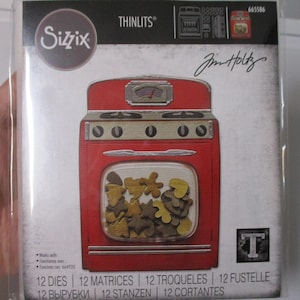 May include: A red metal die-cut of a vintage oven with a window showing a variety of cookie shapes. The packaging includes the text "Thinlits" and "Sizzix" and the signature "Jim Holtz".