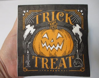 May include: Black and orange Halloween themed decorative sign with the text "Trick or Treat" and a jack-o'-lantern with a white face.