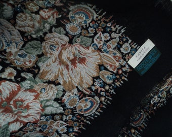 May include: Black floral patterned scarf with a green label that reads "VANITA FORTE de MARMI PROCTOWNICK MADE IN ITALY 100% PURE NATURAL WOOL"