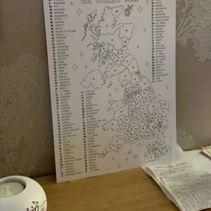 May include: A black and white map of the United Kingdom with numbered regions and corresponding city names listed on the side. The map is titled "UK Sales Map".