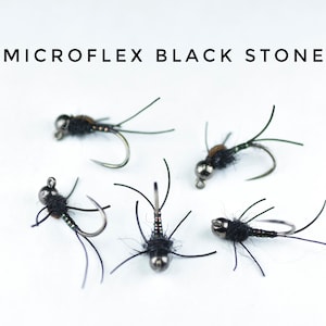 May include: Five black and green Microflex Black Stone fly fishing flies with silver beads.