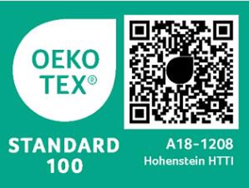 May include: A teal rectangular label featuring the white OEKO-TEX STANDARD 100 logo on the left side. On the right, a black and white QR code is displayed above the text A18-1208 and Hohenstein HTTI, indicating textile safety certification.