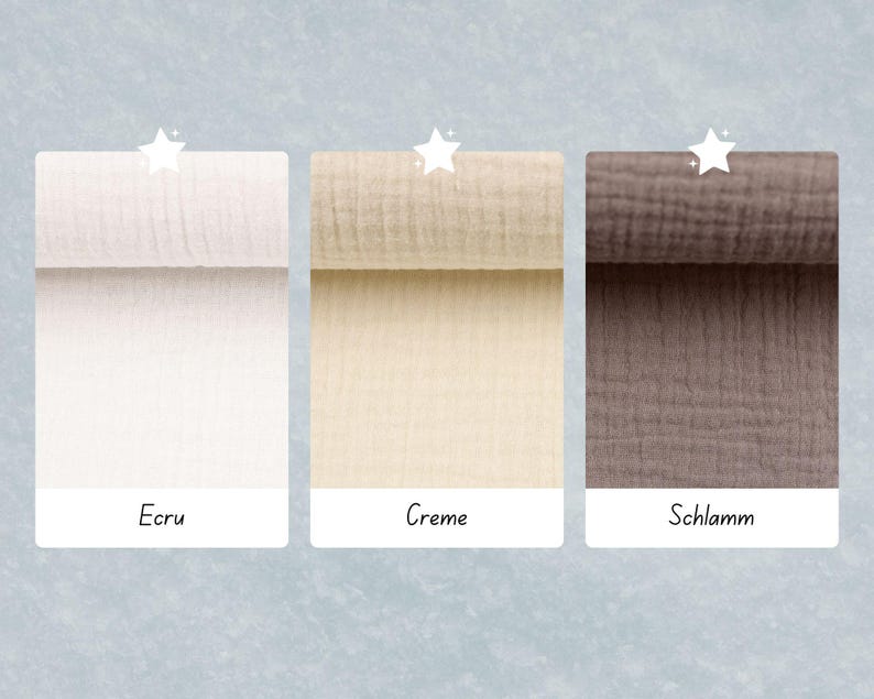 May include: Three fabric swatches in different colors: ecru, creme, and schlamme. The swatches are rolled up and have a textured, gauze-like appearance.