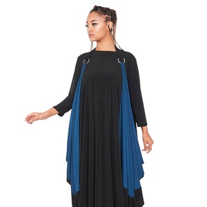 May include: A black and teal maxi dress with a draped design and silver rings at the shoulders.