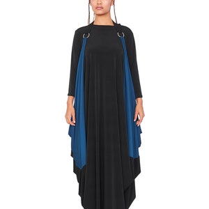 May include: A black maxi dress with a teal blue overlay and silver rings at the shoulders. The dress has a loose, flowing fit and a high neckline.