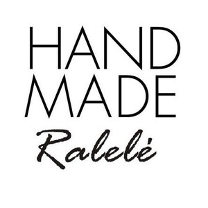 May include: A black and white graphic design featuring the word HAND MADE in a clean, sans-serif capital font stacked on two lines, positioned above the word Ralel&eacute; written in a black, stylized, cursive script font on a plain white background.