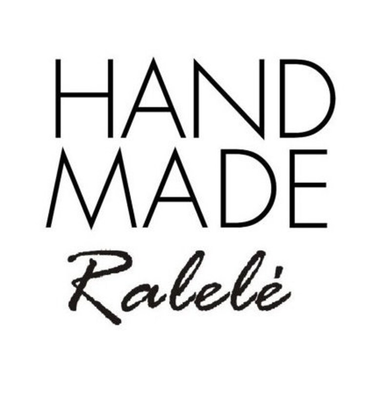 May include: A black and white graphic design featuring the word HAND MADE in a clean, sans-serif capital font stacked on two lines, positioned above the word Ralel&eacute; written in a black, stylized, cursive script font on a plain white background.