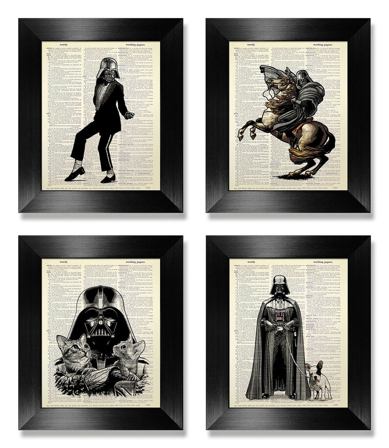 May include: Set of four framed prints featuring Darth Vader in various humorous situations. The prints are on a dictionary page background. The first print shows Darth Vader dressed as Michael Jackson performing the 'moonwalk'. The second print shows Darth Vader riding a horse. The third print shows Darth Vader with two cats. The fourth print shows Darth Vader walking a dog.