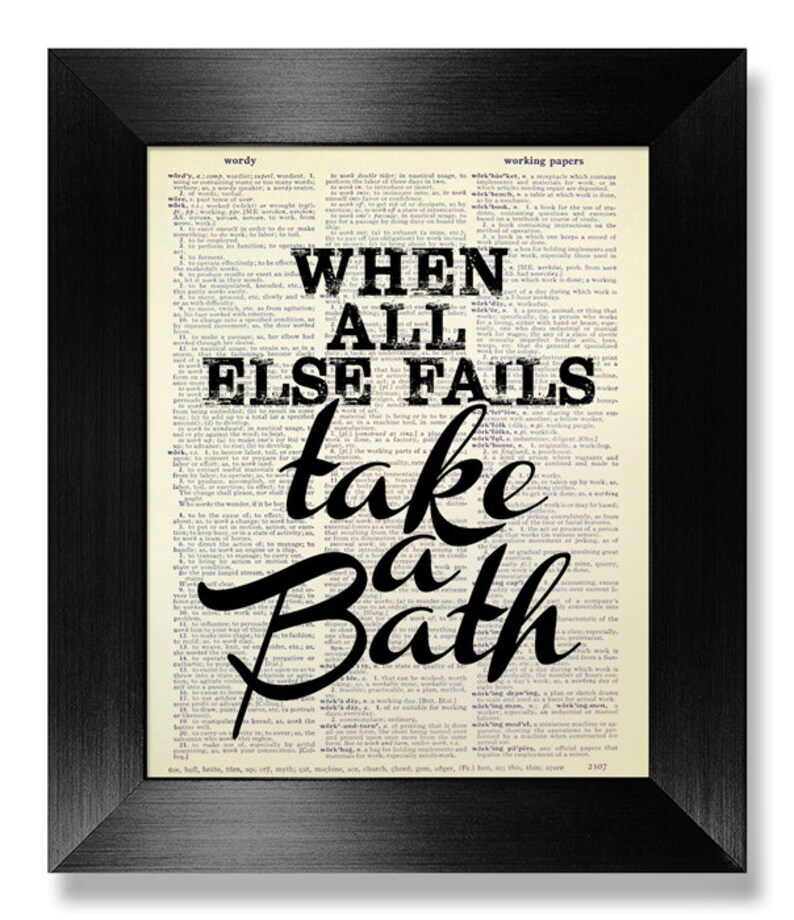 May include: A black framed print with a white background and black text that reads "When all else fails take a bath". The text is superimposed on a page from a vintage dictionary.