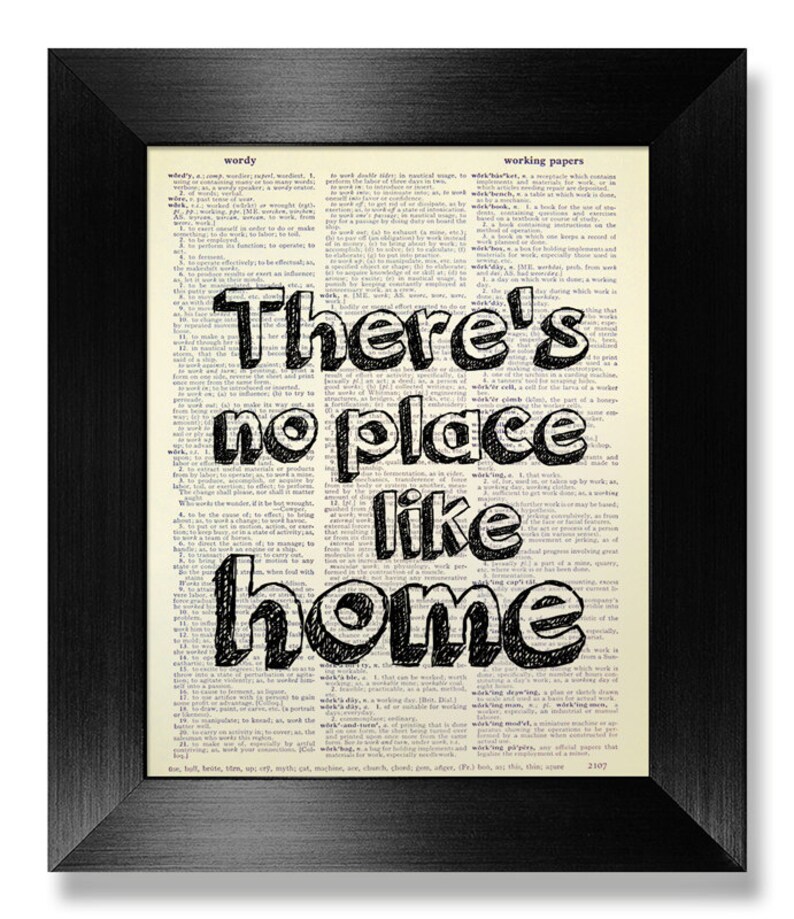 May include: A black and white typography print with the text "There's no place like home" printed on a vintage dictionary page.