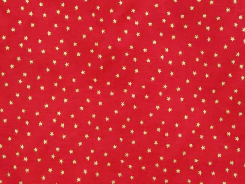 May include: Red fabric with a repeating pattern of small gold stars.