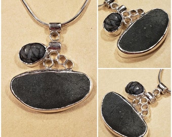 Natural River Rocks supported with an abstract Sterling Silver.