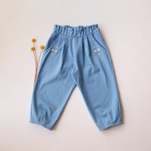 Girls Light Blue Denim Paperbag Waist Trousers with &quot;Petite Daisy&quot; Embroidery – Comfortable, Stylish Kids Pants