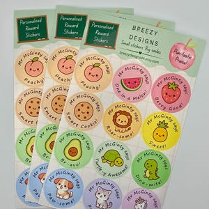 May include: Three sheets of circular reward stickers featuring cartoon illustrations of fruits, animals, and food items. Each sticker includes the text Mr McGinty says and a pun. The header reads Personalised Reward Stickers and BREEZY DESIGNS.