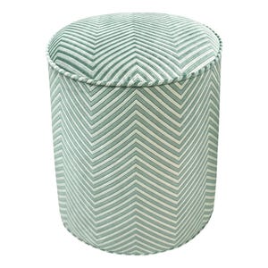May include: A round, green and white chevron patterned ottoman.