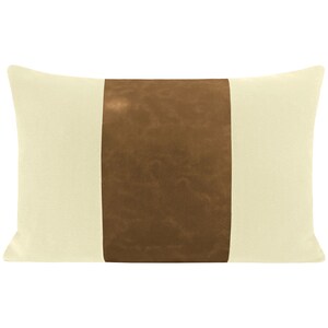 May include: A cream-colored pillow with a brown leather-like stripe down the center.