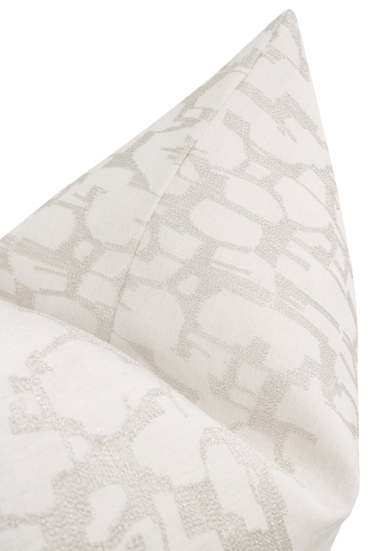 May include: White pillow with a subtle, embossed geometric pattern in a light gray color.