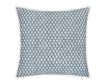 May include: A blue and white patterned throw pillow with a white border. The pillow has a geometric design with small white leaves on a blue background.