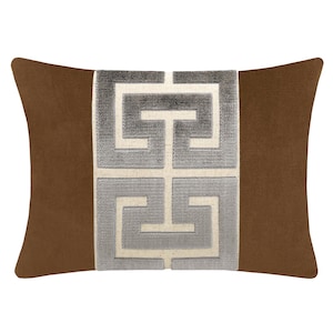 May include: A brown throw pillow with a white and gray geometric pattern.