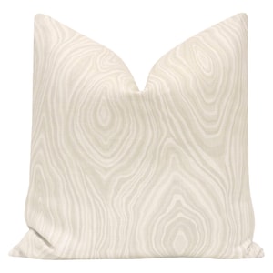 May include: A beige throw pillow with a woodgrain pattern.
